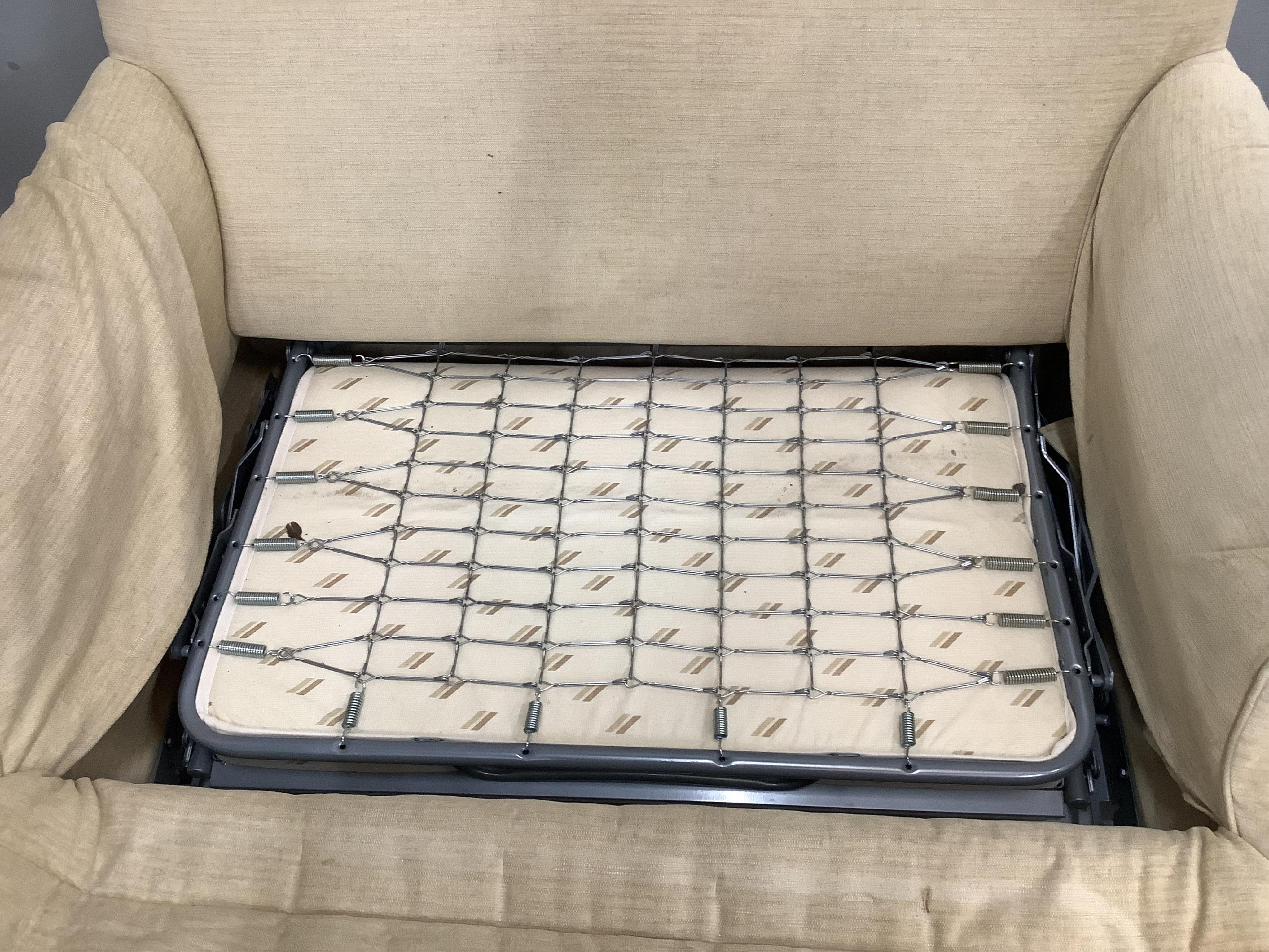 A modern two seater sofa bed, width 150cm, depth 90cm, height 80cm. Condition - good